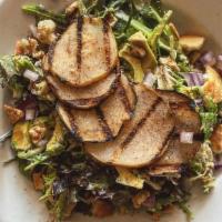 Grilled Pear Salad · Smoky grilled pickled pears, blü cheese, avocado, spicy candied walnuts, red onion, pita cr...