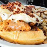 Chicken & Waffle Benedict · Fried chicken topped with 2 poached eggs*, covered in our homemade maple cream sauce; sprink...