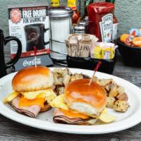 Breakfast Sliders Combo · Two sliders topped with your choice of ham, bacon or sausage; each topped with an egg* cooke...