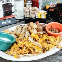 Breakfast Tacos · Scrambled eggs with your choice of taco meat, ham, bacon, sausage or chorizo on warm corn to...