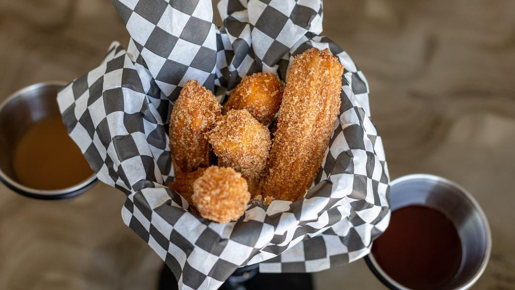 Churros · In-house fried to order, served with house dipping sauce