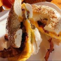 Bacon Bagel Sandwich.. · 3 slices of Bacon, Fried Egg, Avocado, Cheese on your choice of Bagel