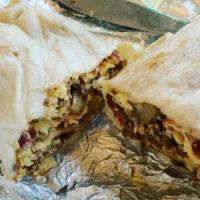 Bacon And Chorizo Burrito.. · Bacon and Chorizo, Eggs, Potatoes, Cheese and Roasted Salsa on a White, Wheat, or Spinach To...