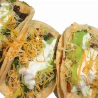Tacos American Style · Served with corn tortillas, lettuce, cheese, sour cream, onions, cilantro and guacamole.