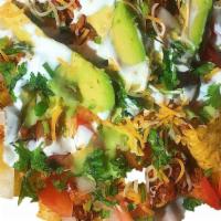 Chips Taco Salad · Corn chips, rice, pinto beans, lettuce, tomatoes, onions, cilantro, sour cream, cheese, guac...