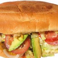 Torta · Served on telera bread with mayo, cheese, pinto beans, lettuce, avocado, sour cream, sliced ...