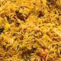 Chicken Biryani · Basmati rice cooked with boneless chicken and special spices.