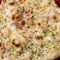 Garlic Naan · Most popular. Freshly baked bread seasoned with garlic prepared fresh in tandoor Indian clay...