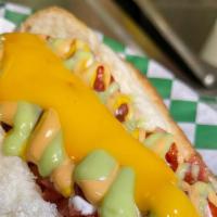 Bacon Wrapped Hot Dog · Bacon-wrapped hot dog topped with mayonnaise, ketchup, mustard, grilled onions, tomato, chip...