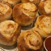 Pepperoni Rolls · Eight pieces. Pepperoni, mozzarella and parmesan rolled in fresh dough and baked. Served wit...