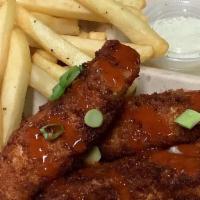 Chicken Strip Basket · Three piece hand breaded chicken with fries and choice of sauce.