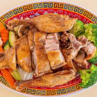 Crispy Duck · Duck marinated with all the authentic chinese spices then fried served w steamed vegetable