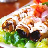 Tinga Flautas · Crispy flour or corn tortillas rolled with your choice of chicken tinga, beef or picadillo. ...