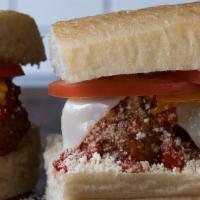 Meatball Hero Sandwich · Hot. Meatballs, mozzarella, Parmesan, cheddar, tomato, marinara, butter, and oil and vinegar.