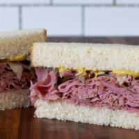 Taxi Driver Sandwich · Hot. Pastrami, pepper jack, sautéed onions, grilled jalapenos, and spicy mustard on sourdough.