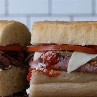 Sicilian Sandwich · Hot. Roast beef, mozzarella, Parmesan, tomato, marinated mushrooms, marinara, butter, and sa...