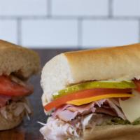 Dagwood Sandwich · Cold. Pastrami, ham, turkey, roast beef, swiss, cheddar, lettuce, tomato, onion, pickle, may...
