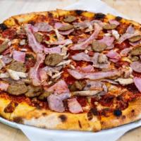 Regular Carnivore · Sausage, pepperoni, meatballs, chicken, ham, bacon, crushed tomatoes, basil, aged mozzarella.