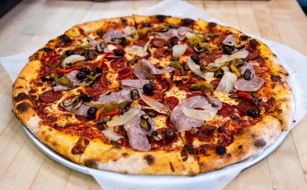 Regular Classic Combo · Sausage, pepperoni, Mediterranean olives,  caramelized onions, mushrooms, bell peppers, crushed tomatoes, basil, aged mozzarella.