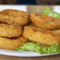 Onion Rings · Giant stack of thick-cut gourmet onion rings with choice of dipping sauce.