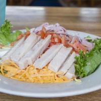 Chef Salad · Fresh greens topped with turkey, ham, shredded Monterey jack and cheddar cheese, tomatoes, a...