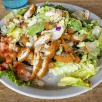 Asian Crispy Chicken Salad · Crispy chicken tenders over green salad mixed with our sweet sesame vinaigrette, fried wonto...