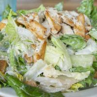 Caesar Salad · Crisp romaine lettuce tossed in our tangy caesar dressing. topped with croutons, tomatoes, a...