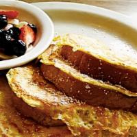 French Toast · Thick sliced cinnamon french sourdough bread. Served with fresh seasonal fruit.