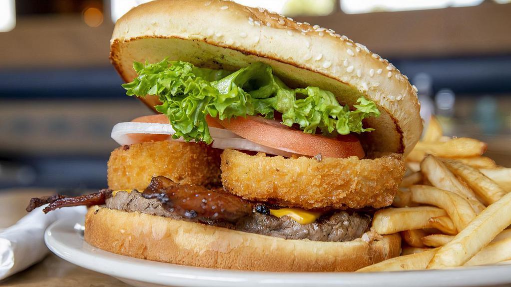 The Mountain Sized Burger · One full pound of angus beef, American cheese pepper jack cheese, two strips of bacon, and a giant onion ring on a large bun. Our choice angus chuck burgers are served with lettuce, tomato, onion, and a kosher pickle spear.