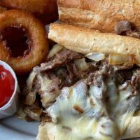 Philly Cheesesteak · Burien's only authentic Philly Cheesesteak! Thinly sliced rib eye steak piled high with gril...