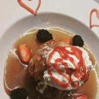 Peach Bread Pudding · Warm caramel sauce, fresh berries, whipped cream.