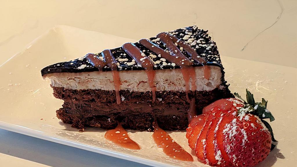 Chocolate Fudge Cake · Butter cream, strawberry coulis.