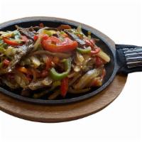 Fajitas  · Served sizzling with sautéed bell peppers, onion and ranchera salsa,tomatillo salsa served w...