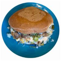 Mexican Torta · Mexican bread beans cheese lettuce jalapeño fried onion guacamole and chipotle mayonnaise ch...