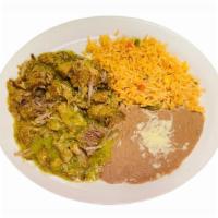 Chile Verde · Slow cooked pork in salsa verde served with rice and beans.