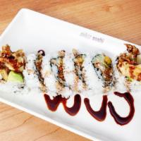 Spider Roll · Deep-fried soft shell crab, cucumber, avocado, and sesame seeds with sweet sauce.