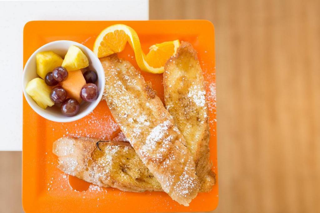 Vegan French Toast · French baguette hand cut and dipped in a vanilla vegan custard with a side of fresh fruit