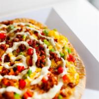 Toluca · Chorizo, bell peppers, Monterey jack topped w/jalapeno cream cheese