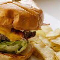 Hickmans Burger · Angus beef patty, fried egg center, American cheese, applewood bacon, mayo, lettuce, tomato ...