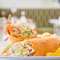 Chicken Caesar Wrap · Grilled chicken, romaine tossed with Caesar dressing topped with house croutons & Parmesan c...