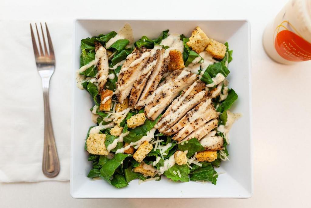 Chicken Caesar Salad · Grilled chicken, romaine tossed with Caesar dressing topped with house croutons & Parmesan cheese