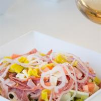 Italian Chopped Salad · Black forest ham, capocollo, geno salami, pepperoncini, tomato, onion, provolone, romaine, c...