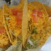 Taco On Corn · Beef, Chicken, or Chorizo with lettuce, tomato and cheese