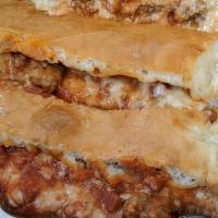 Mauro'S  Sausage Stromboli · Two sausage links, Mozzarella cheese and hot roasted pueblo chile blend baked in fresh dough...