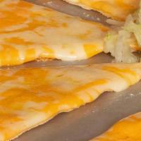 Cheese Crisp · A fresh flour tortilla toasted and covered with melted mixed cheese.