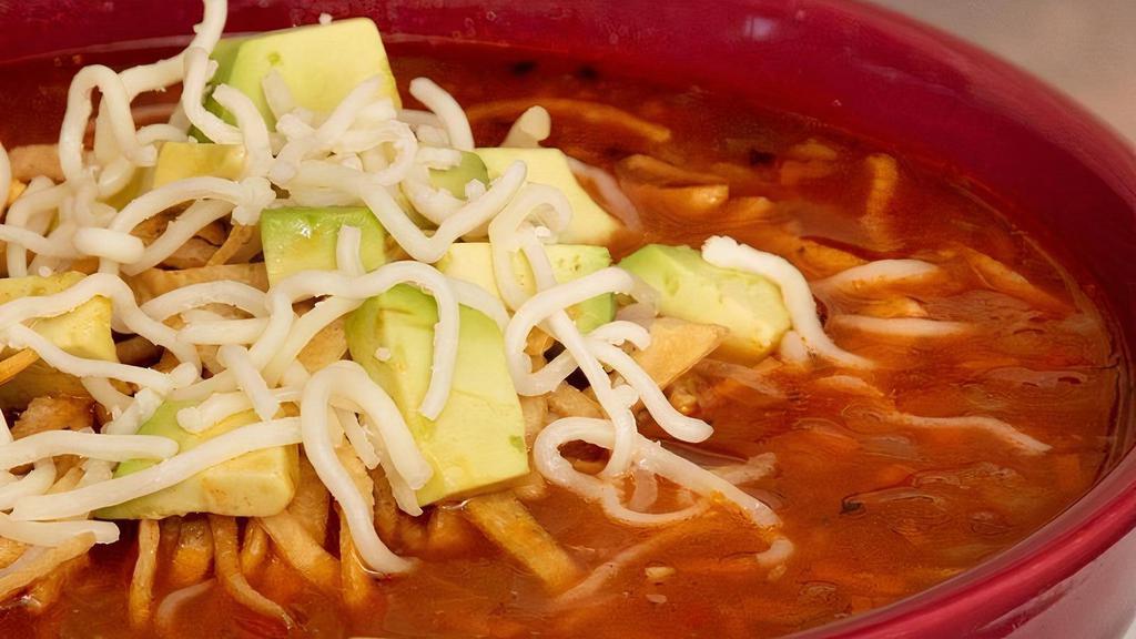 Tortilla Soup (Bowl) · Homemade chicken broth loaded with diced chicken breast,  topped with cheese, avocado and tortilla strips.