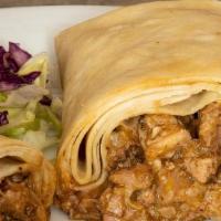 Green Chile Burro · A tender slow-cooked combination of beef and pork green chile, wrapped in a fresh flour tort...