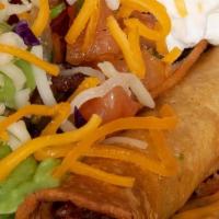 Combo #6 · 3 Flautas (rolled tacos) served with guacamole, sour cream, cheese and salsa fresca.  Served...