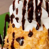 Fried Ice Cream · A scoop of vanilla ice cream covered with frosted flakes, deep fried, and topped with whippe...