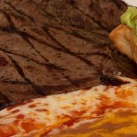 Tampiquena · Carne asada (charbroiled steak) and a cheese enchilada served with beans, rice, guacamole an...